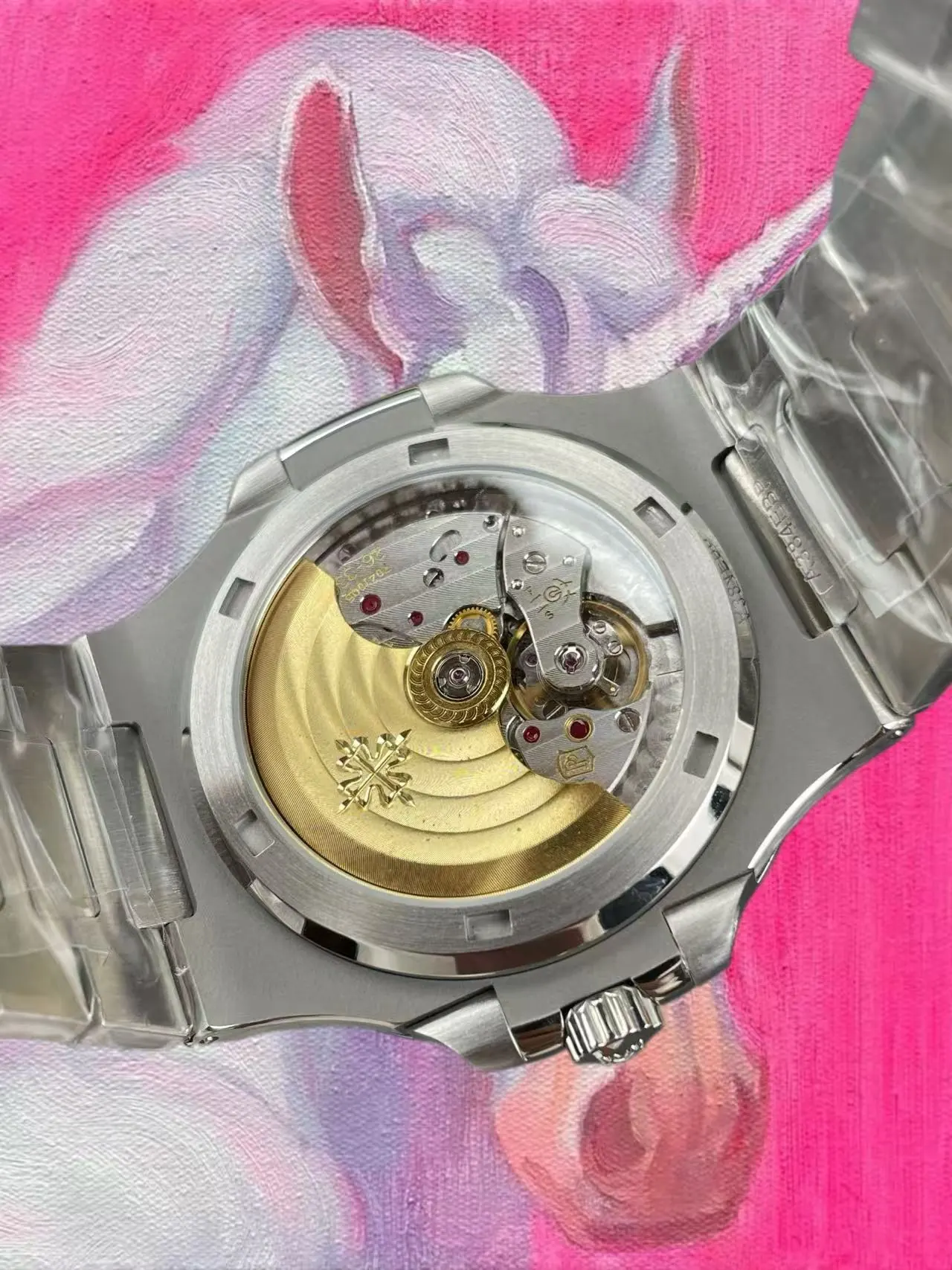 5711 透底：金色自動陀與 324 機芯夾板